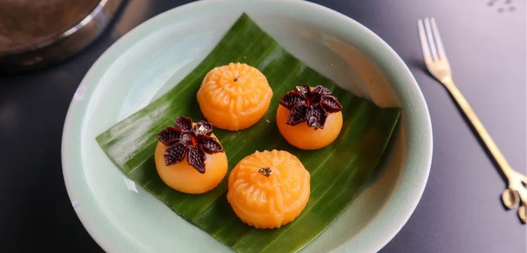 Plate of small round desserts with a fork