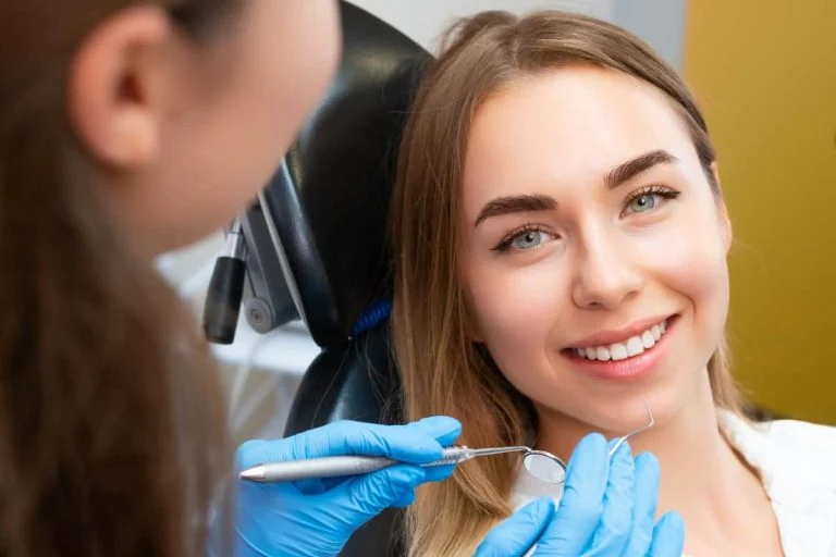 Smiling woman in the dental chair during a checkup
